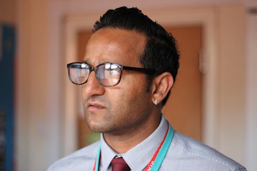 Close-Up Photo of Man Wearing Eyeglasses