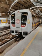A metro arriving at a New Delhi station