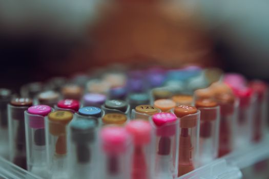 Close-up of colorful markers in a container, ideal for school or craft projects.