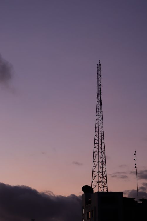 Free A towering metal structure silhouetted against a purple twilight sky in Dhaka. Stock Photo