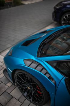 High-angle view of a blue Lamborghini showcasing luxury design and style.