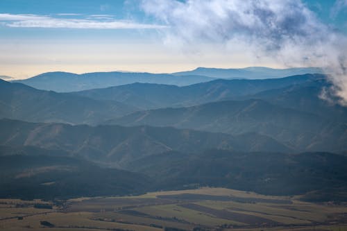 Foto profissional grátis de céu azul, fotografia aérea, montanhas