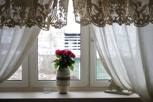 Vase with Flower on a Windowsill