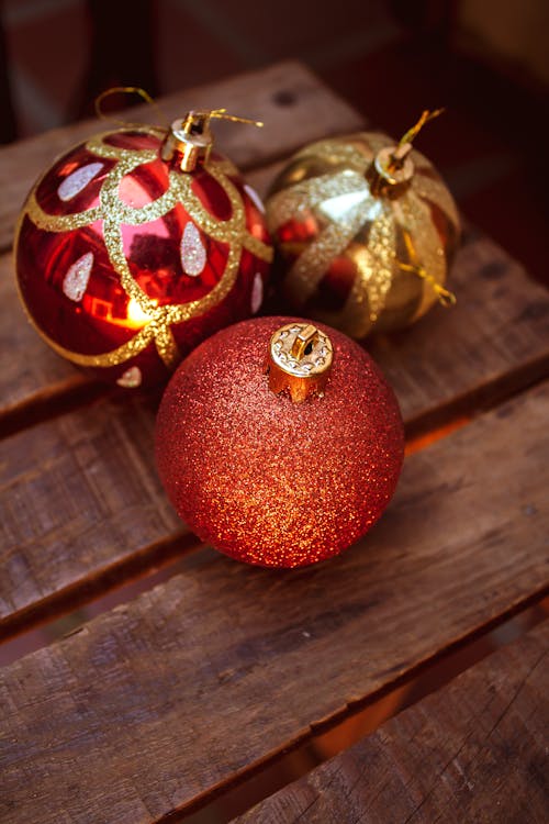 Red and Gold Christmas Ornaments in Close-Up Photography 