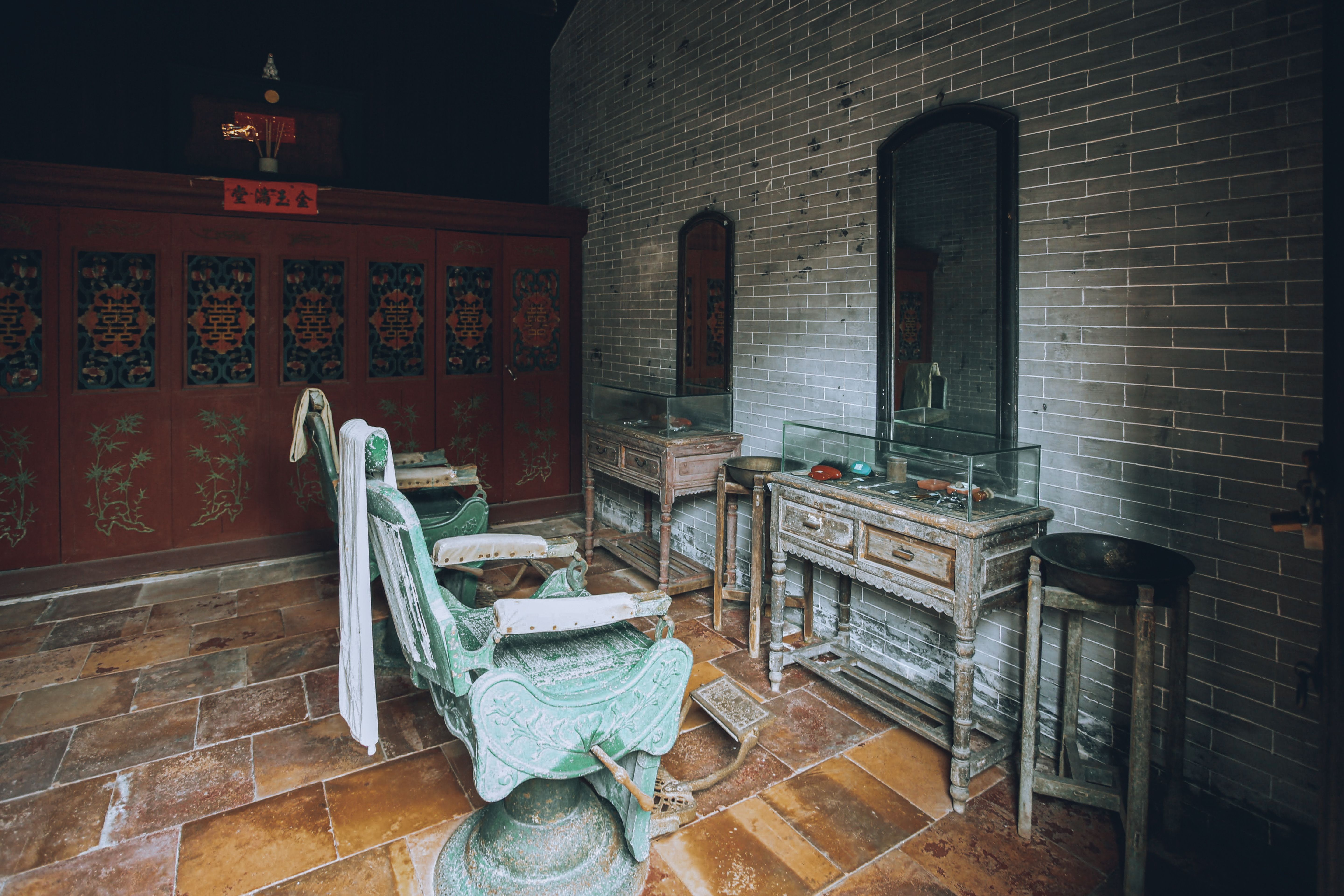 A vintage hair salon featuring retro chairs and mirrors, evoking an old-world charm.