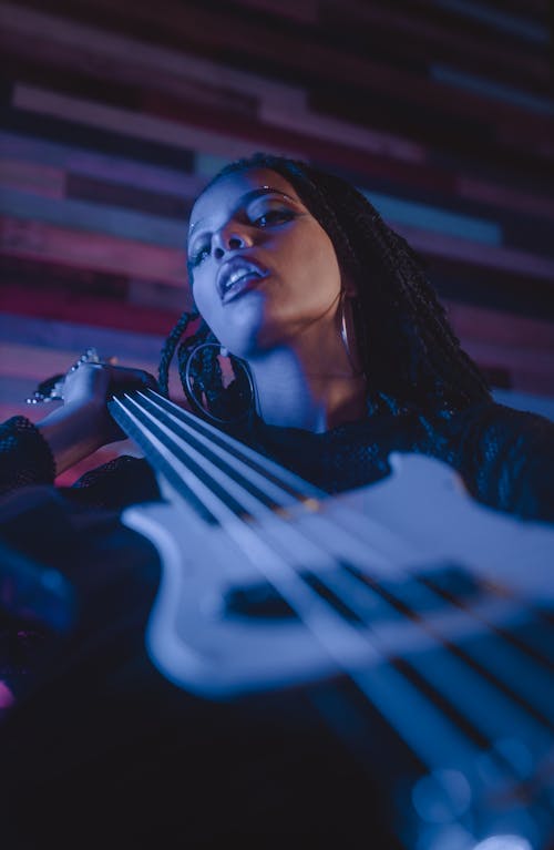 A Woman Holding Bass Guitar