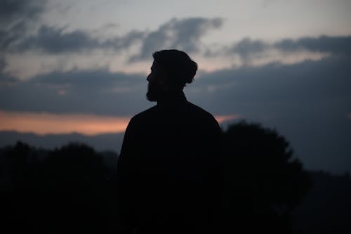 Silhouette of Man during Sunset