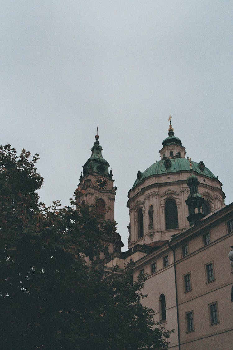 Tower And Dome Of The Church Of Saint Nicholas In Prague