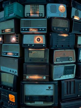A nostalgic display showcasing various vintage radios, highlighting retro technology and design.