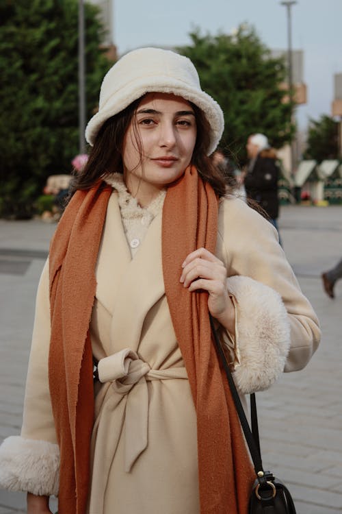 A Woman Wearing Hat and Coat 