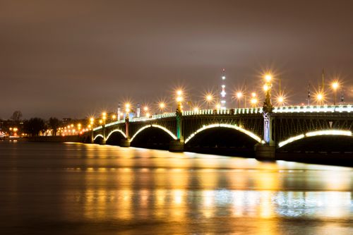 Free Stunning night view of the illuminated Troitskiy Bridge in Saint Petersburg, Russia. Stock Photo