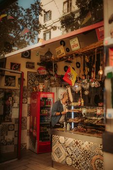 A cozy vintage shop with unique decor and a person browsing through items in a warm ambiance.
