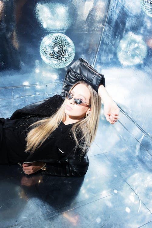 Woman Posing with Disco Ball