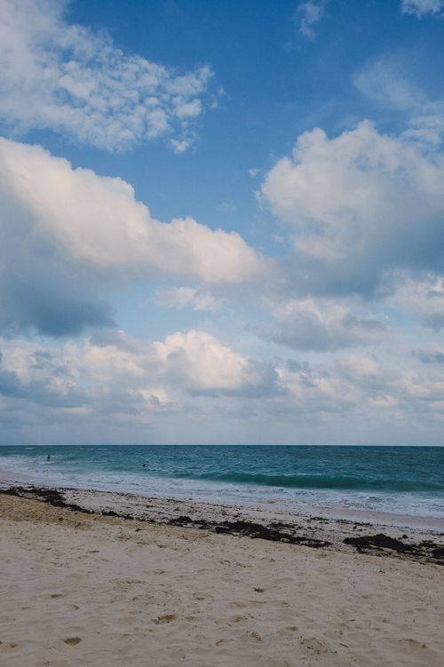 Free Stunning seascape of Cancún's sandy shores under a bright blue sky. Stock Photo