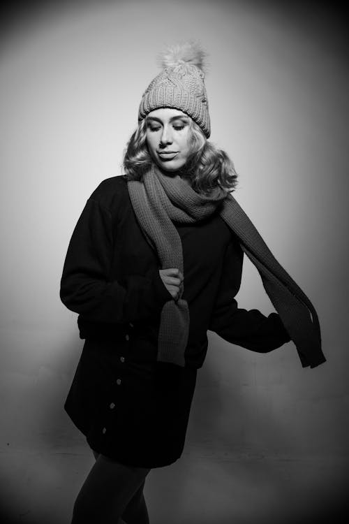Black and White Photo of Woman in Winter Clothes