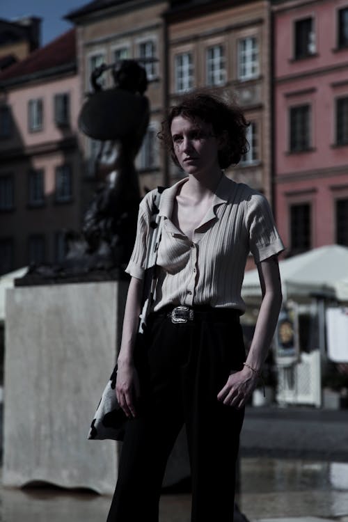 Woman Wearing a Collared Top and Black Pants