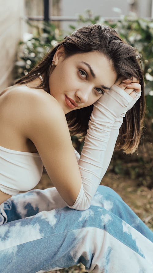 A Woman in White Tube Top Looking Over Shoulder