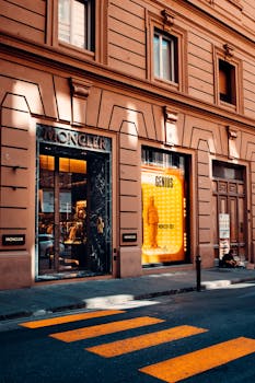 Beautiful Moncler store facade on a street in Florence, Tuscany, featuring classic architecture and vibrant signage.