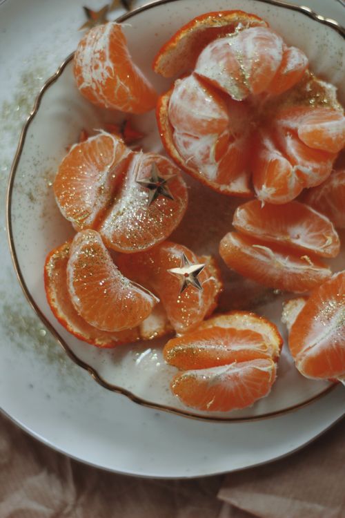 Free Close-up of peeled orange slices with decorative stars, emphasizing freshness and texture. Stock Photo