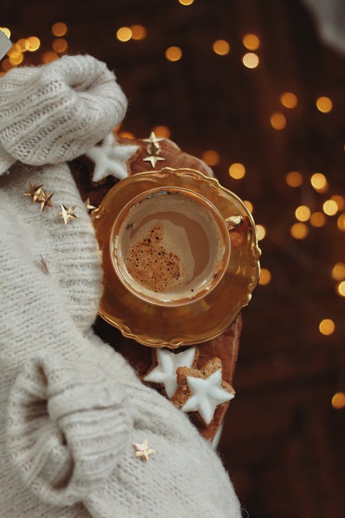 Coffee in Golden Cup in Cozy Decoration