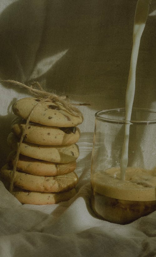 A Stack of Cookies Near the Glass with Coffee and Milk