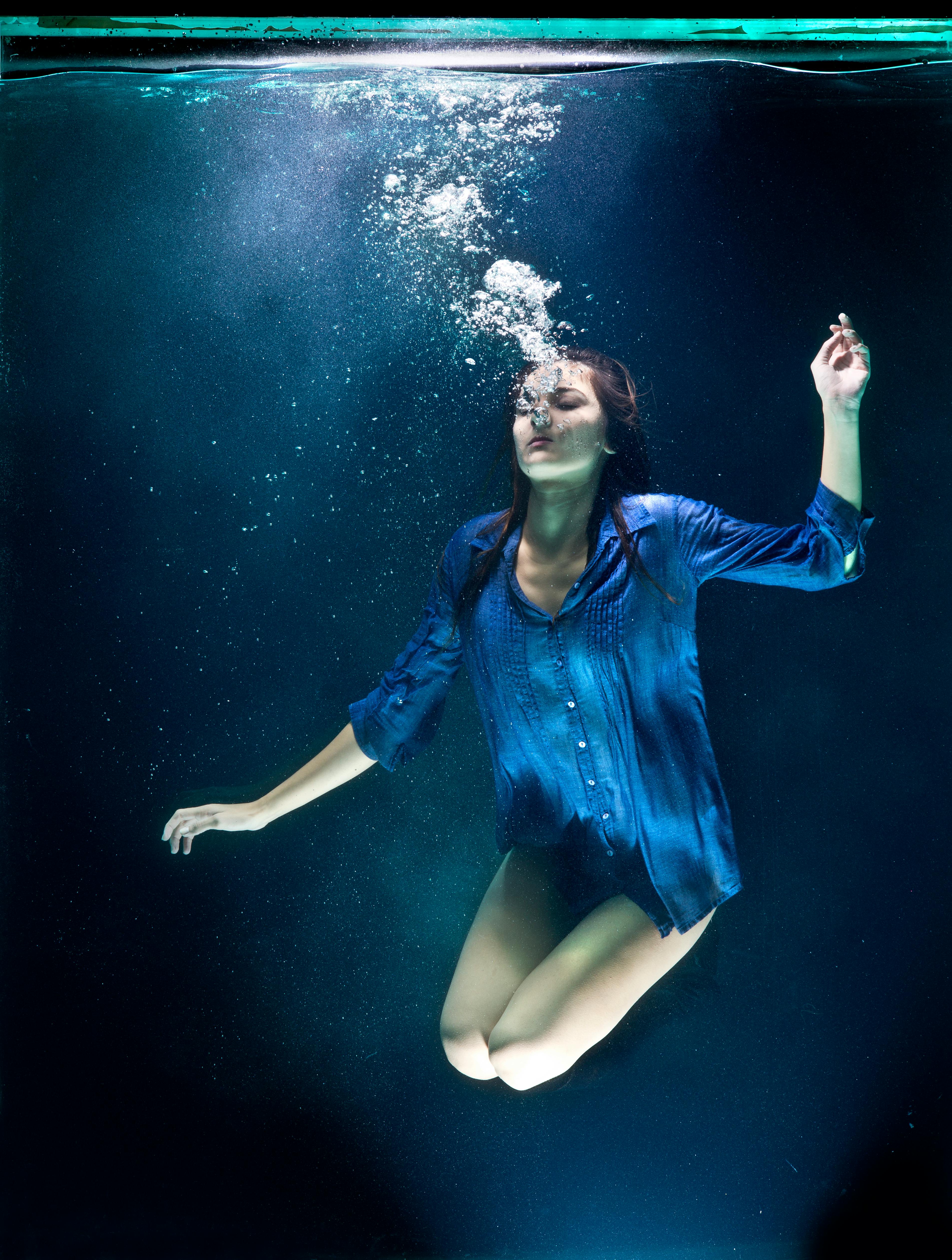 underwater photography of woman