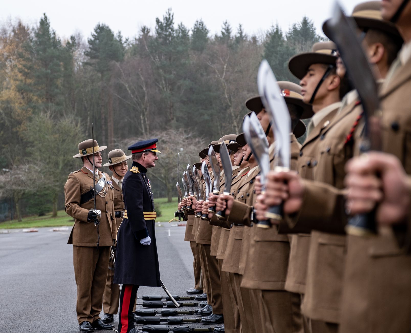 Gurkha soldiers in uniform with kukri knives during a military ceremony in Catterick, England.
