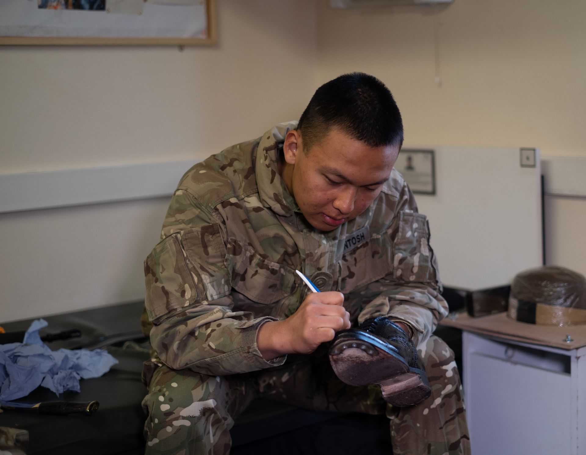 Gurkha cleans shoes