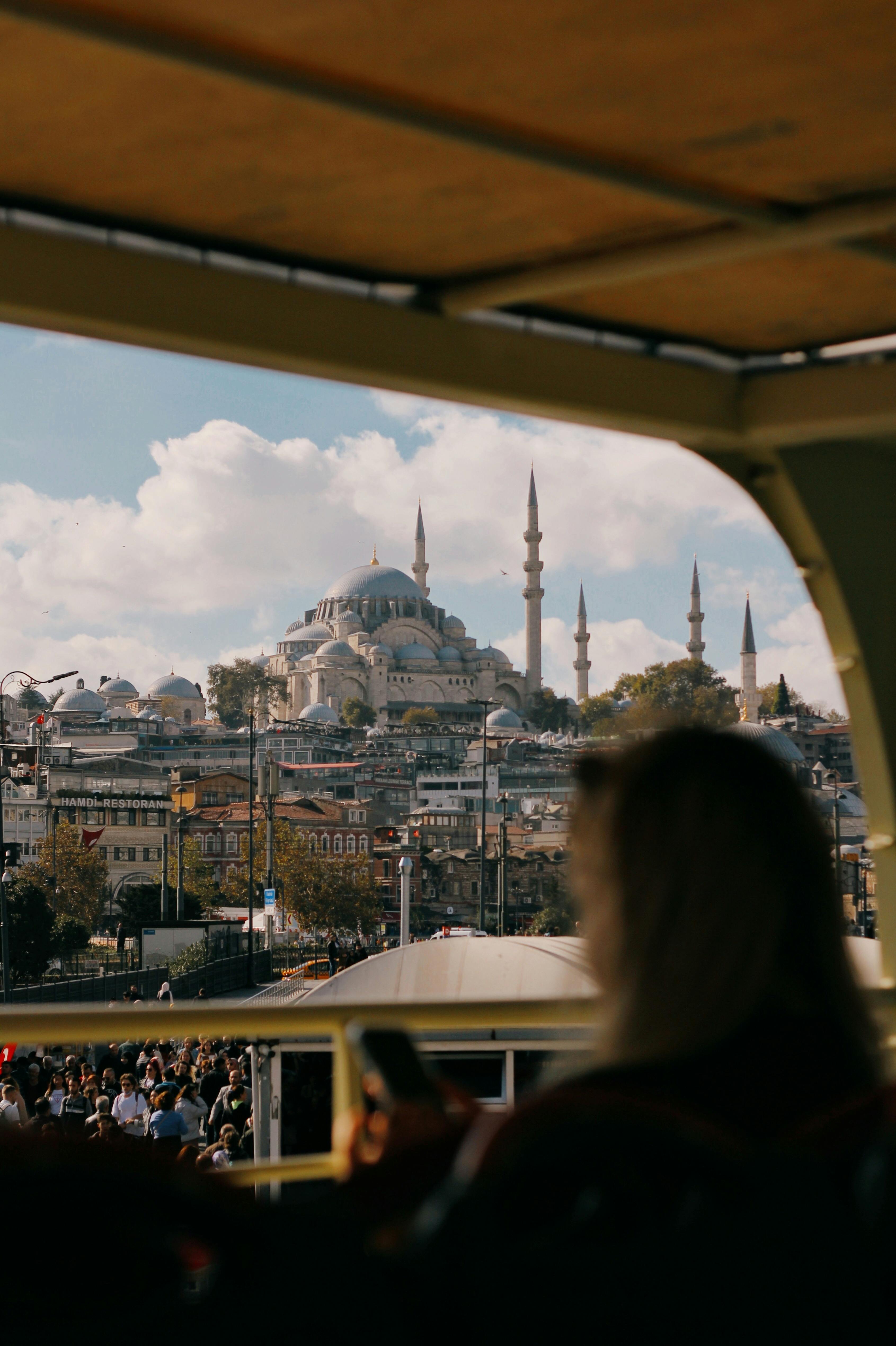 people on a cruise with the view of istanbul turkey