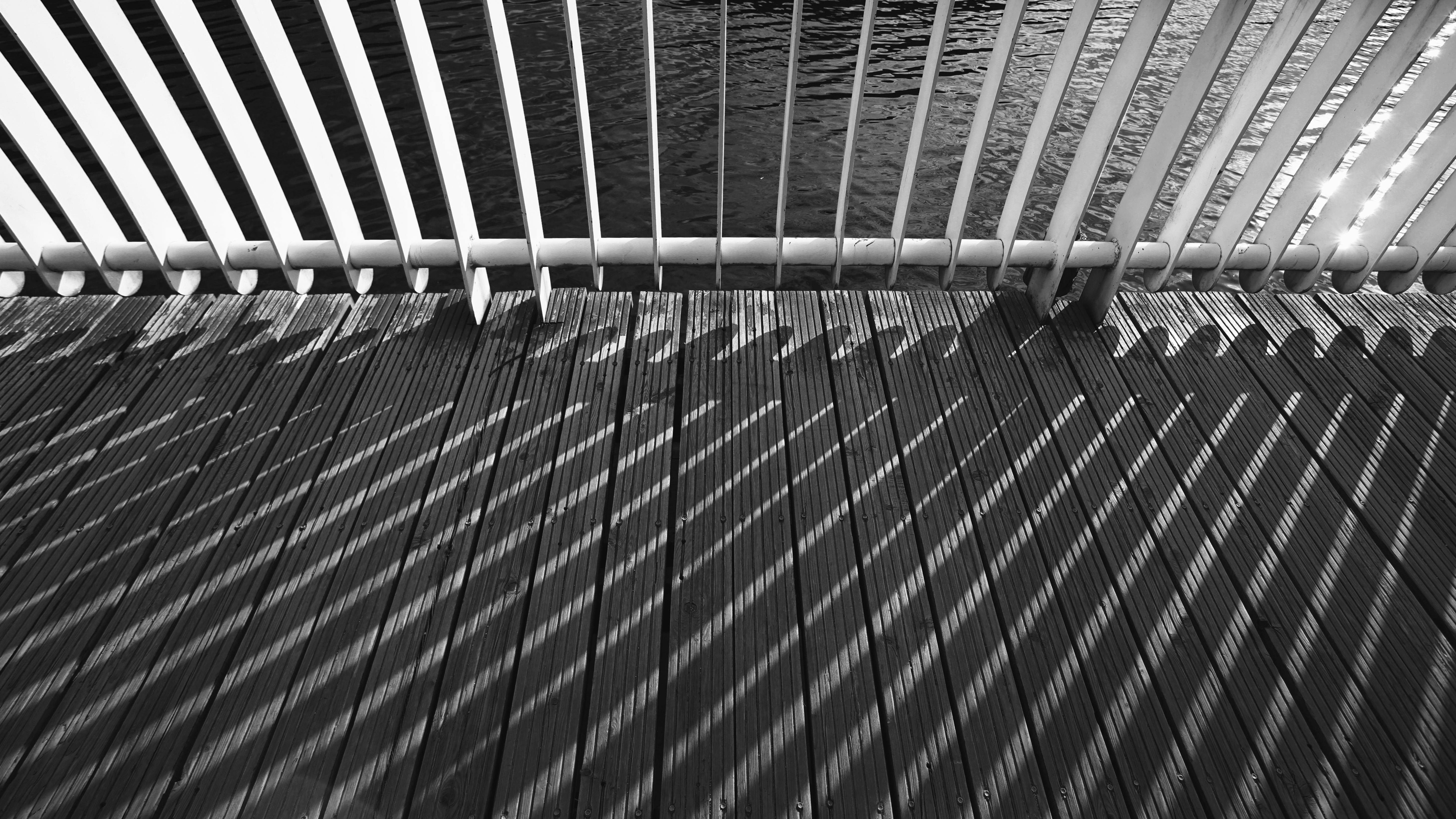 Grayscale Photo Of Shadow Of Metal Railing Free Stock Photo