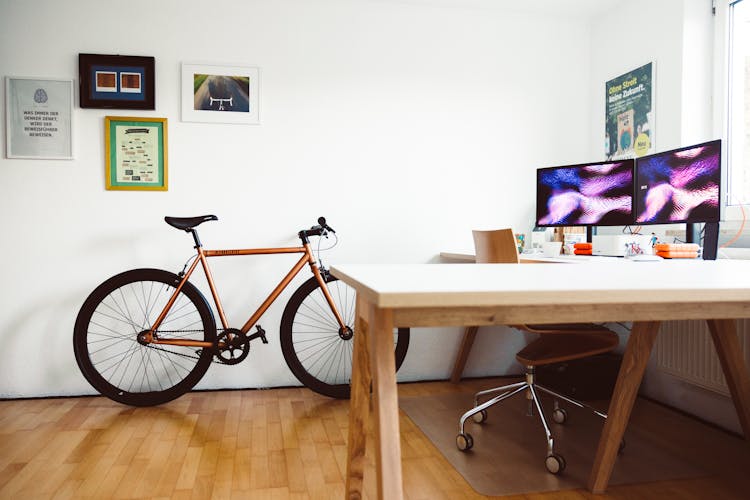 Bicycle In Office With Desk