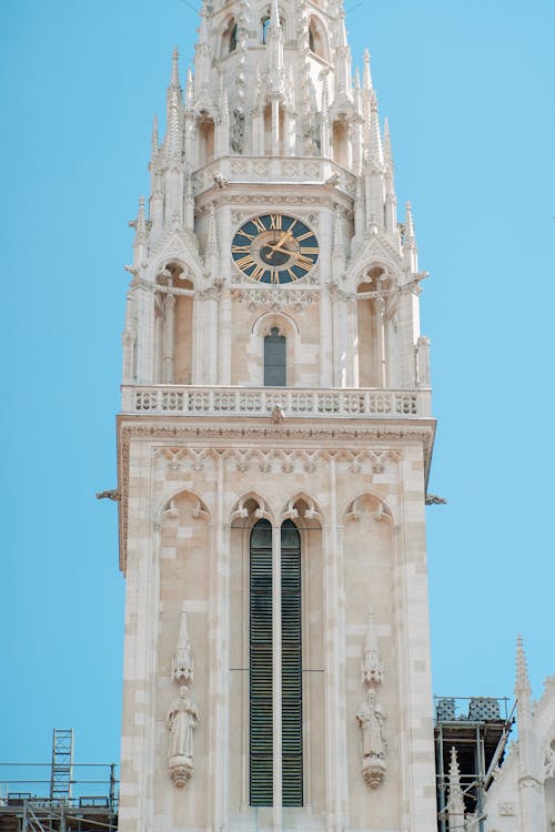 Gothic Historic Building Tower against Blue Sky