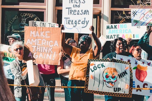 Free People Rallying in Front of Coffee Shop Stock Photo