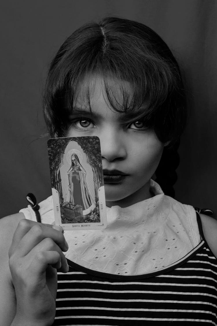 Portrait Of Serious Girl With Tarot Cards