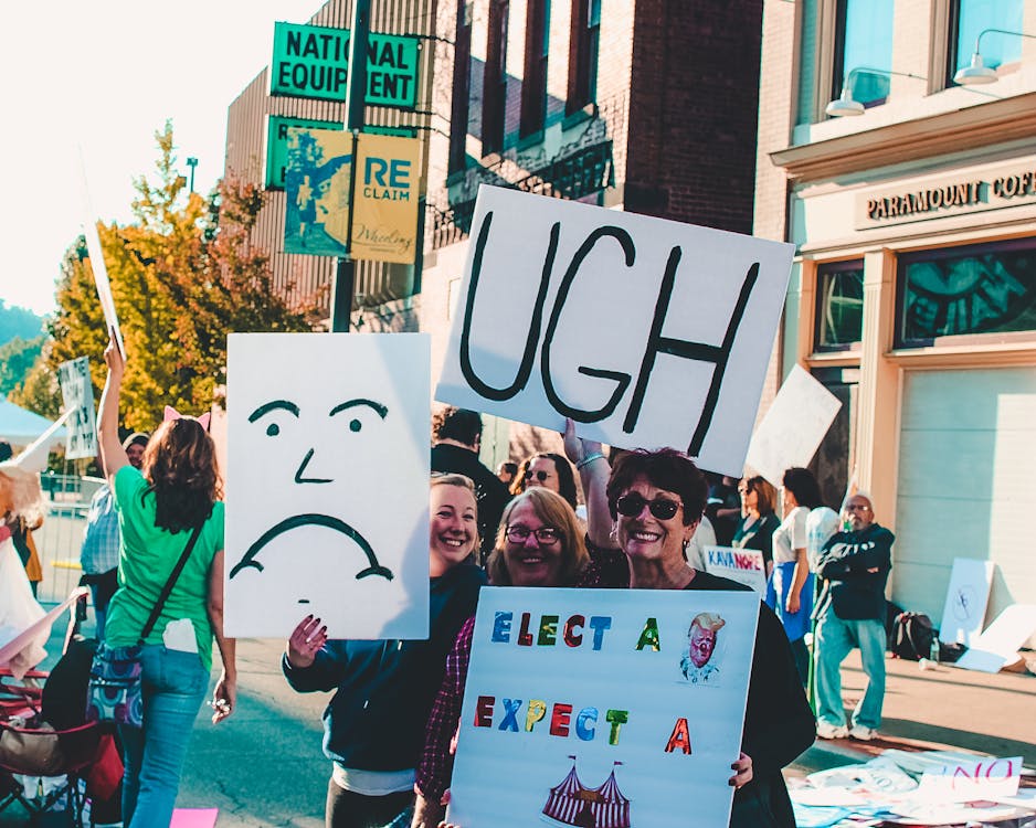 People Holding Banners