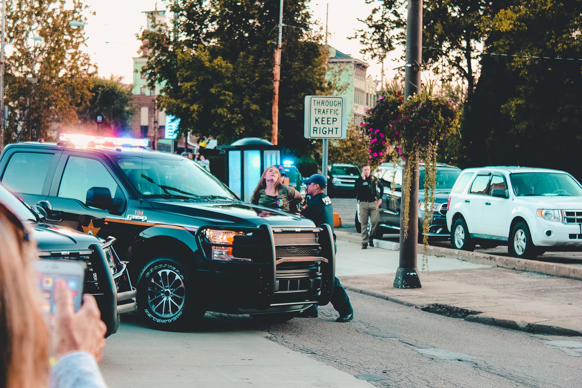 People Standing Beside Black Pickup Truck