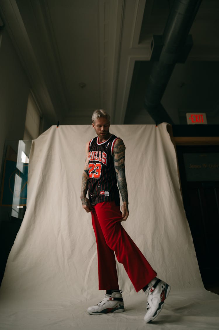 Man Posing In Basketball Tank Top