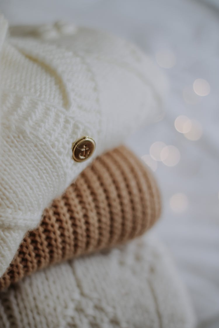 A Close-Up Shot Of Folded Knitted Clothes