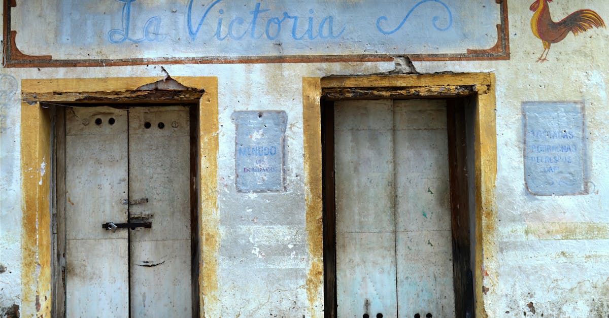 Historic La Victoria facade with rustic doors in Armadillo de los Infante, Mexico.