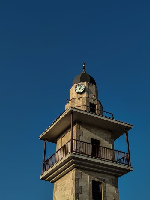 Free A historical watchtower in Balıkesir, Turkey, captured with clear blue skies, showcasing its architectural details. Stock Photo