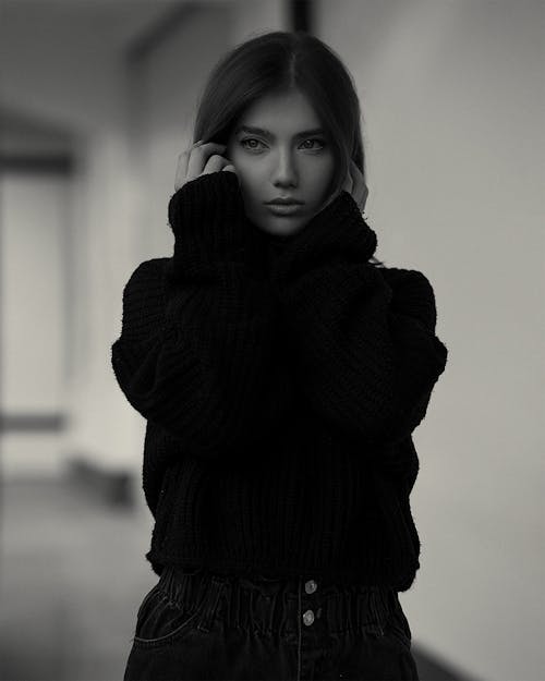 Black and White Photo of a Woman in a Sweater