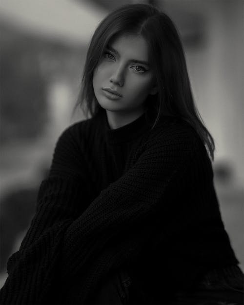 Black and White Photo of a Woman in a Sweater