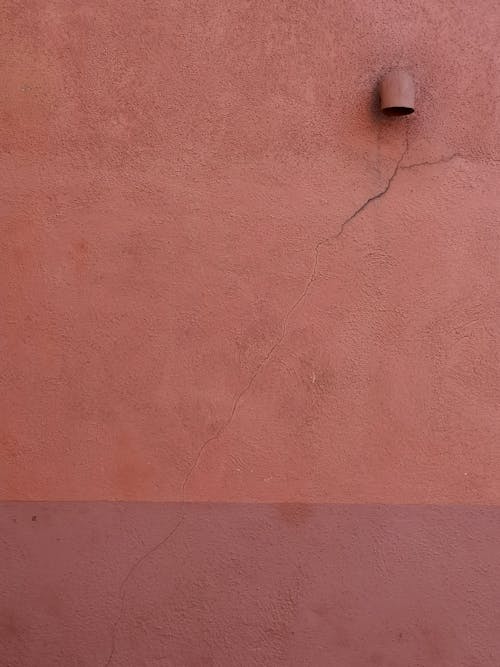 A Pink Rough Wall with Crack