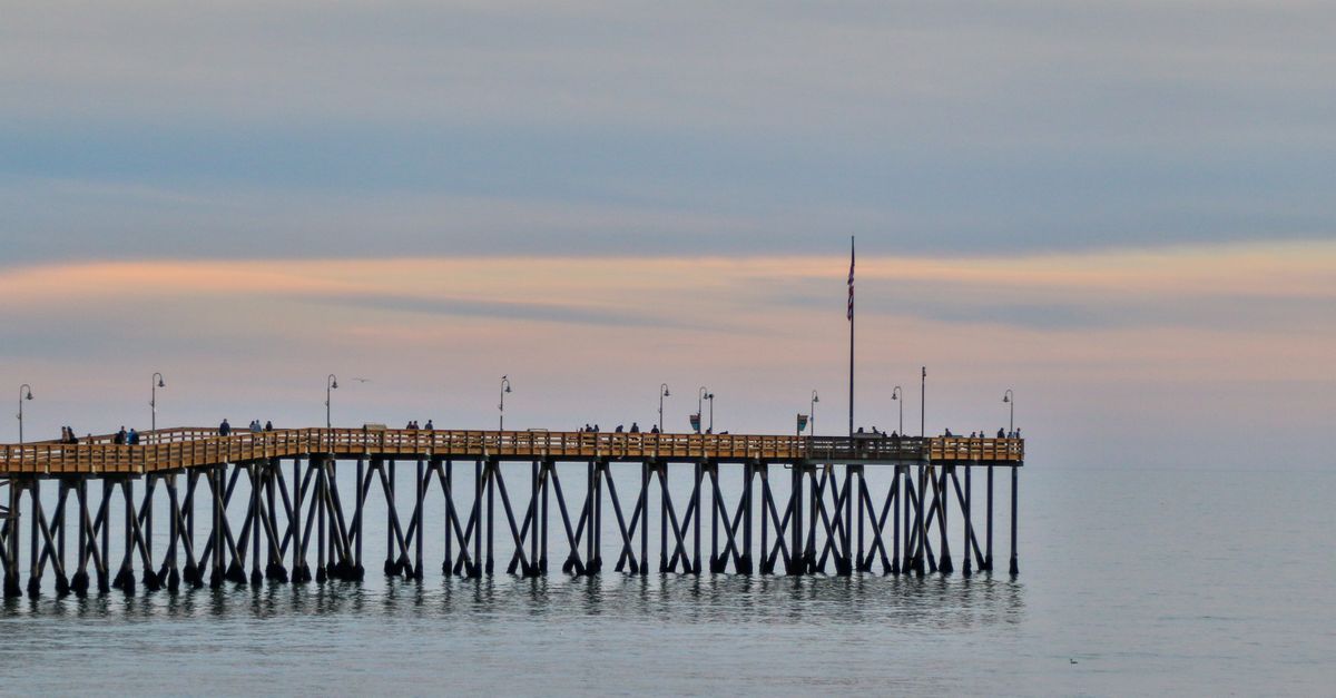 Captivating twilight view of Ventura Pier extending into calm ocean waters.