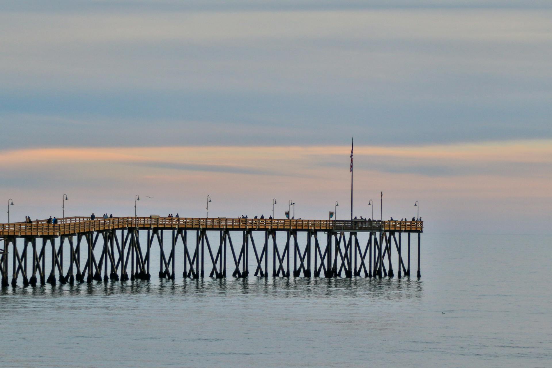 Captivating twilight view of Ventura Pier extending into calm ocean waters.
