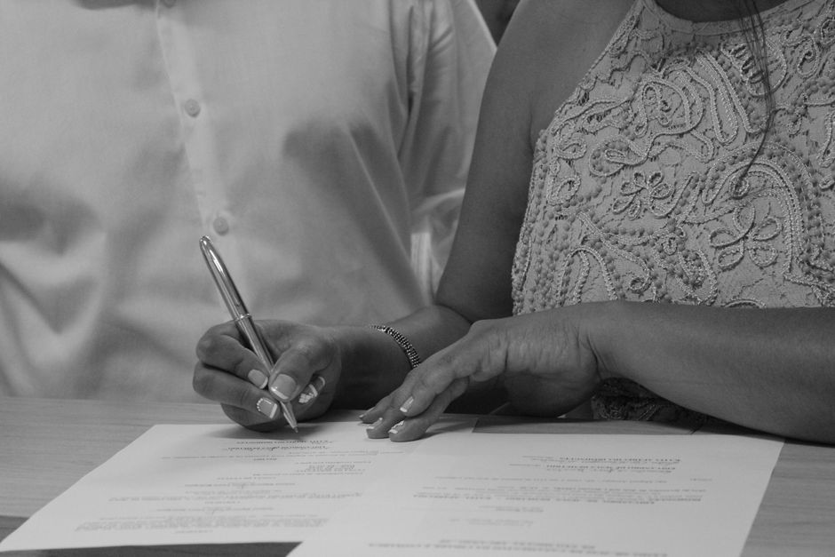 legal contract being signed by spouses legal contract being signed by spouses