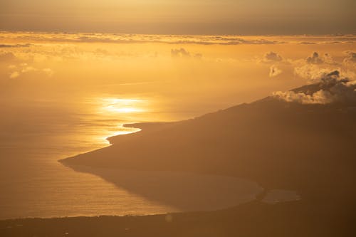 Free Aerial Photography of a Seacoast During Sunset Stock Photo