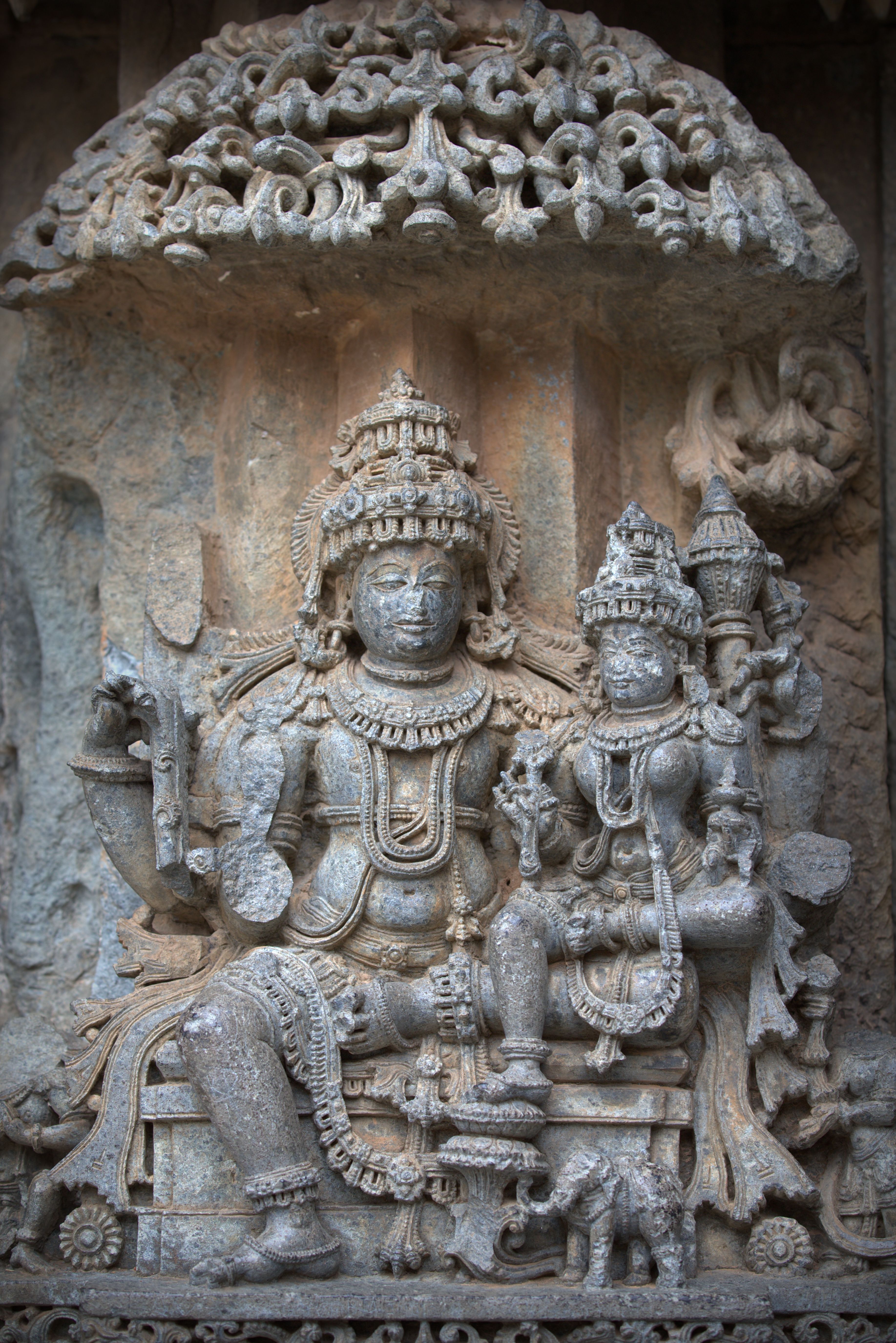 Detailed stone carvings of deities at Somanathapura Temple, showcasing ancient Indian artistry.