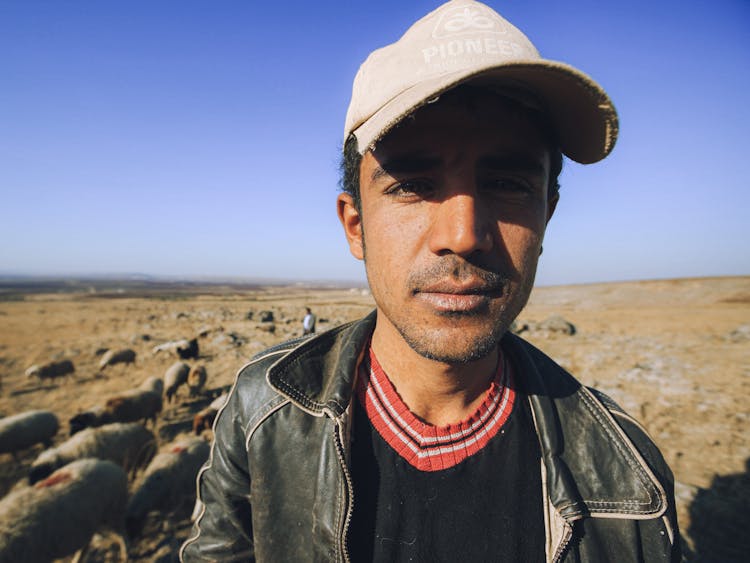 A Man Wearing Old Cap In Close-up Photography