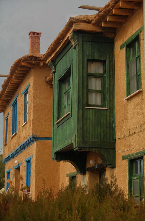 Free Charming traditional Turkish mudbrick houses with colorful facades in a vibrant urban setting. Stock Photo